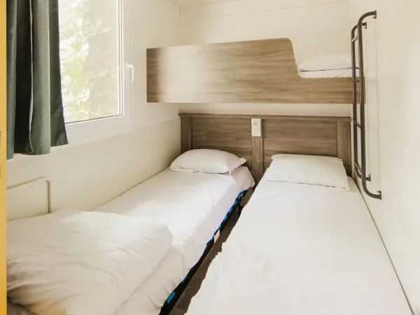 Bedroom with 2 single beds within Roan's Classic Relax.