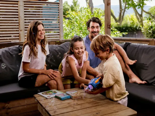 Family enjoys on the lounge sofa.