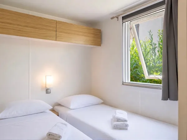 One of the children’s bedrooms in the Supreme mobile home with two bathrooms.