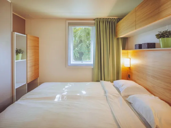 The Roan Premium Lounge bedroom with a double bed.