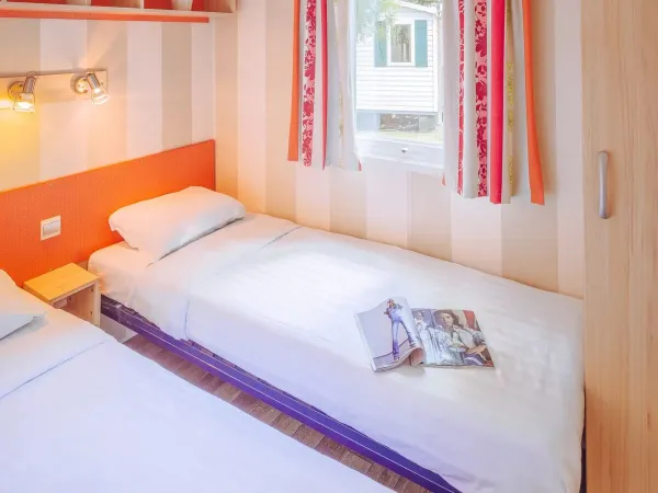 Roan Comfort Plus Lounge bedroom with two single beds.