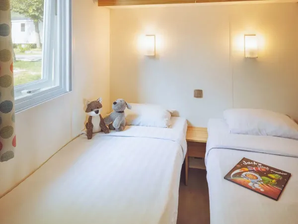 Second bedroom with two single beds from Roan Comfort Plus Lounge.