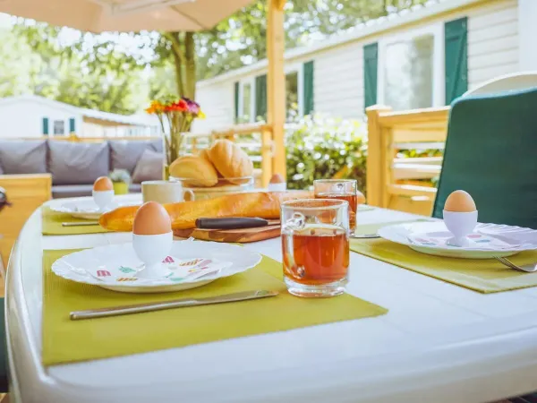 Have breakfast on the decking of the Roan Comfort Plus Relax.