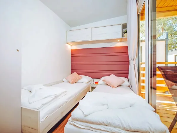 The Roan Comfort Plus Lounge bedroom with two single beds.