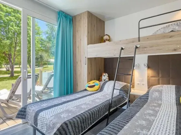 The Roan Premium Zone bedroom with three single beds.