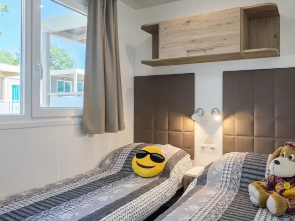 The Roan Premium Zone bedroom with two single beds.