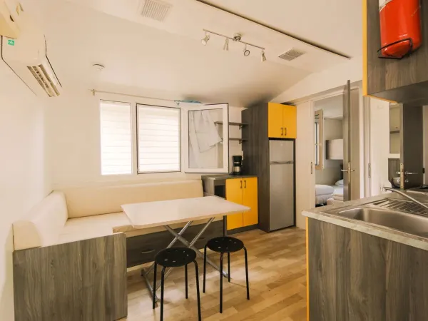 The inside of the Classic Relax consisting of a living room, bedroom, kitchen and bathroom.