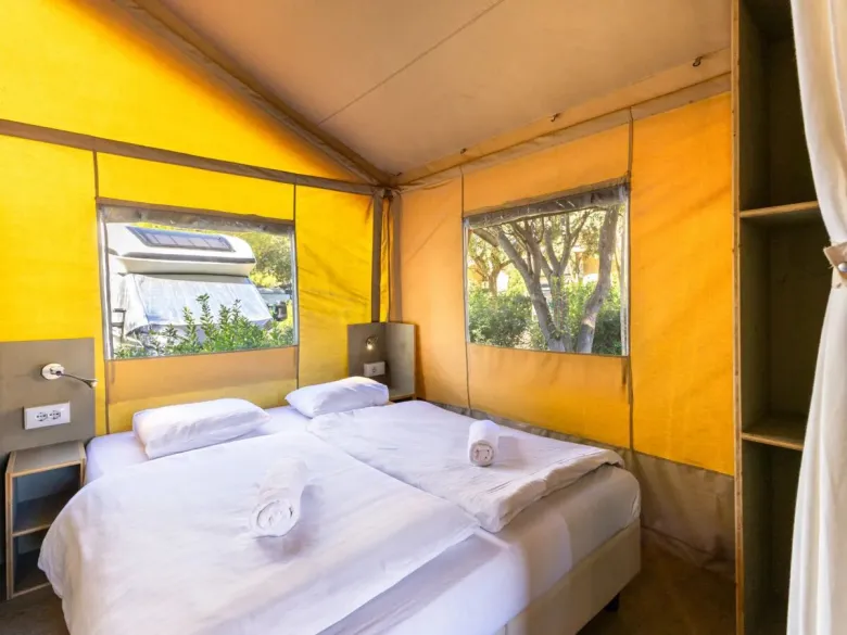 The Roan Lodgetent premium bedroom with spacious double bed.