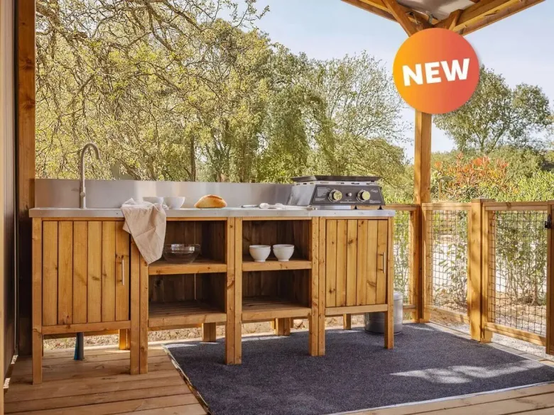 Roan's outdoor kitchen is equipped with a griddle, running water and plenty of storage space.