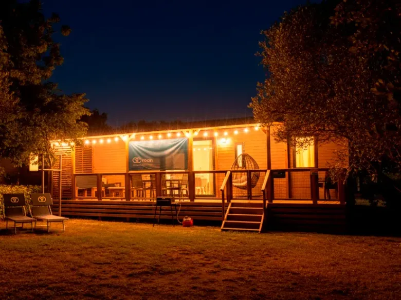 The Supreme Plus Lounge with mood lighting on the veranda.