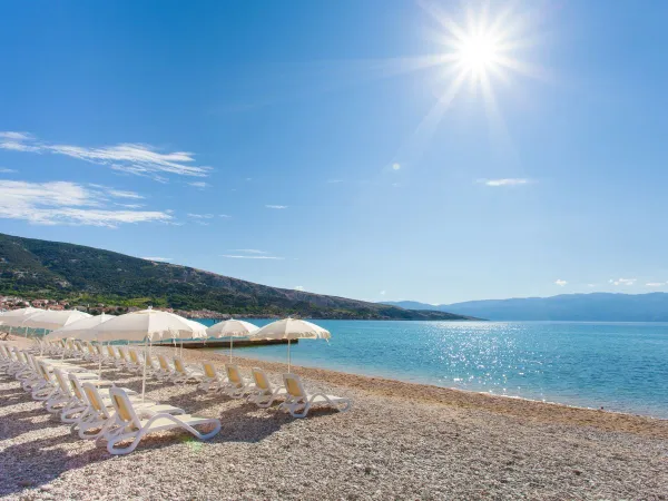 The pebble beach at Roan camping Baška Camping Resort.