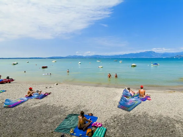 Lively beach at Roan camping Belvedere.