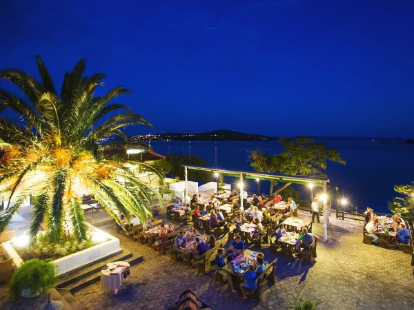 Cozy evening on the terrace overlooking the sea at Roan camping Amadria Park Trogir.