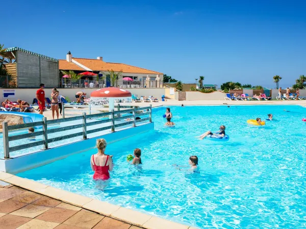 Poolside fun at Roan camping La Dune Des Sables.