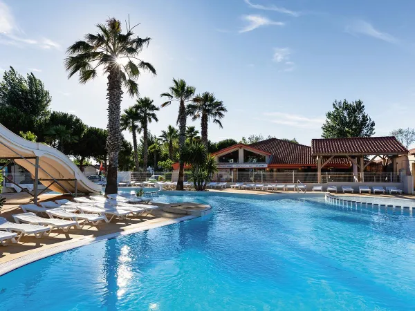 Swimming pool with slides at Roan camping Les Sablines.