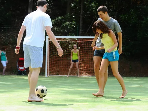 Youths playing soccer at Roan camping Rosselba.