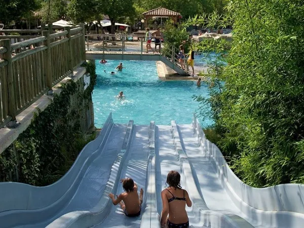 Slide down the waterslide by the pool at Roan camping Le Ranc Davaine.