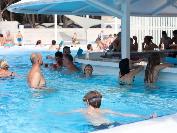 Busy swimming pool at Roan camping Cikat.