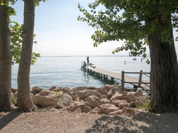 Pier by Lake Garda at Roan camping Cisano San Vito.