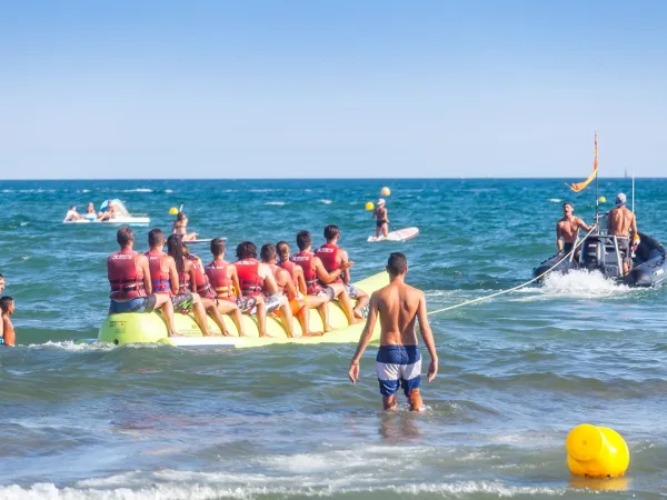 Banana boat activity near Roan camping Club Napoléon.