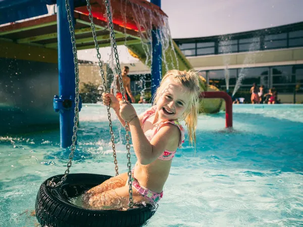 Swing in water playground at Roan camping De Schatberg.