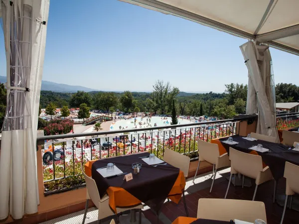 Pool view from the balcony of the restaurant at Roan camping Norcenni Girasole.