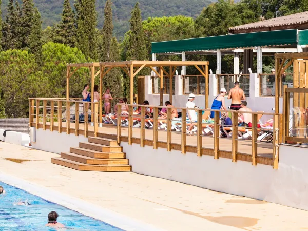 Sunbeds by the pool at Roan camping Domaine Naïades.