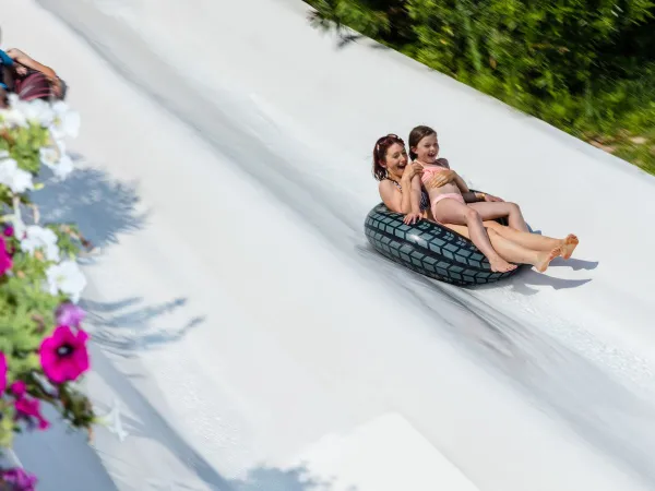 Slide down the wide waterslide at Roan camping Altomincio.