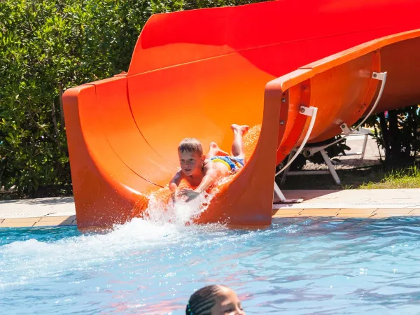 Slide down the waterslide at Roan camping Pra'delle Torri.