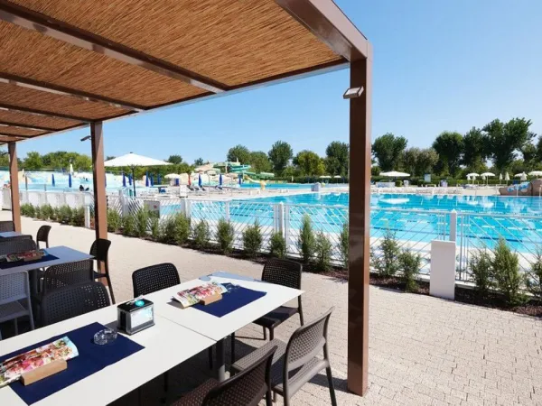 Terrace next to the pool at Roan camping Marina Di Venezia.