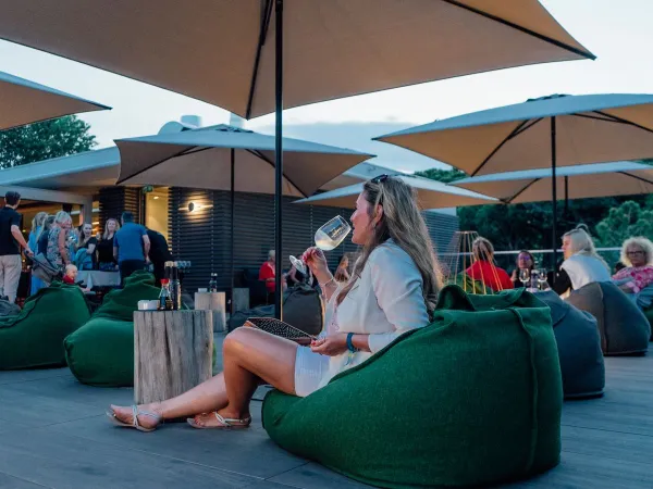 Lounge chairs on the terrace of Roan camping Mediterraneo.