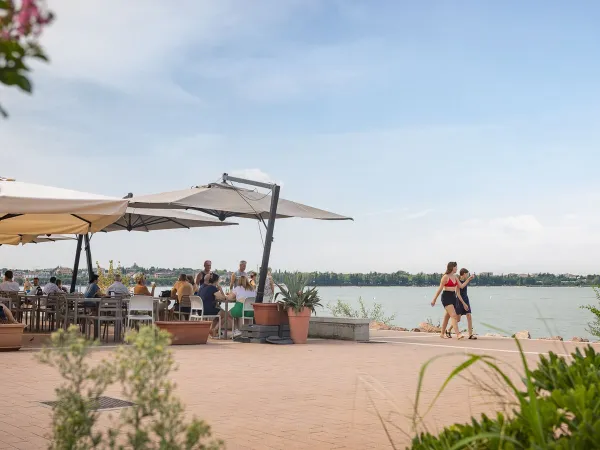 Waterfront terrace at Roan camping Del Garda.