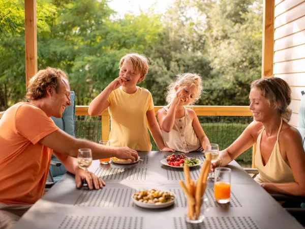 Family fun in the lounge of Roan accommodation at Le Vieux Port campsite.