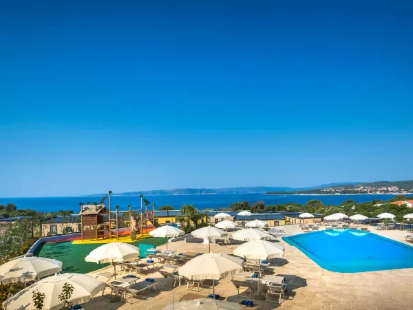 Swimming pool with playground at Roan camping Krk Camping Resort.