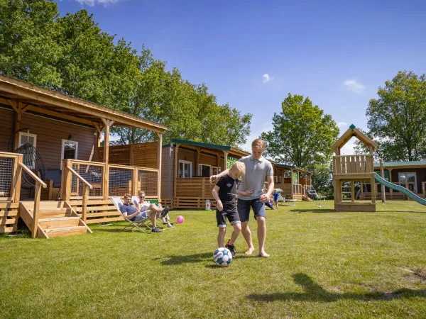 Children playing near the Roan accommodations at Marvilla Parks Friese Meren campsite.
