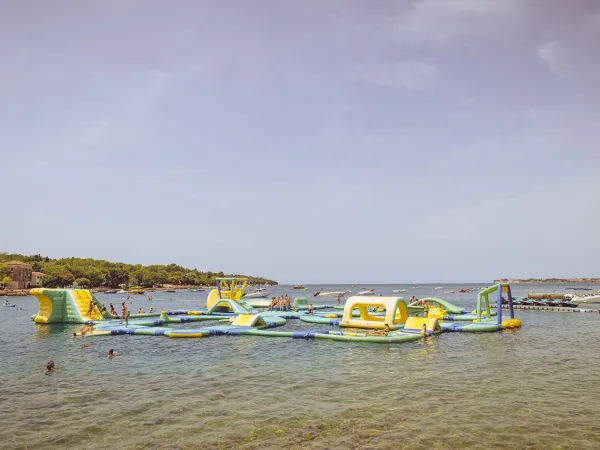 Water playground in the sea at Roan camping Lanterna.