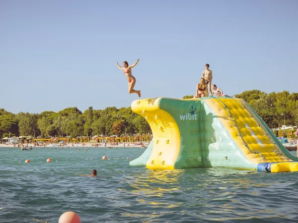 Water bouncy castle at Roan camping Bi Village.