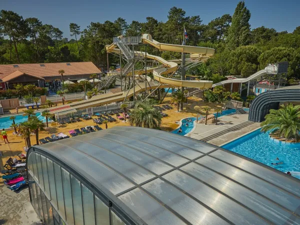 Covered pool and slides at Roan camping La Pinède.