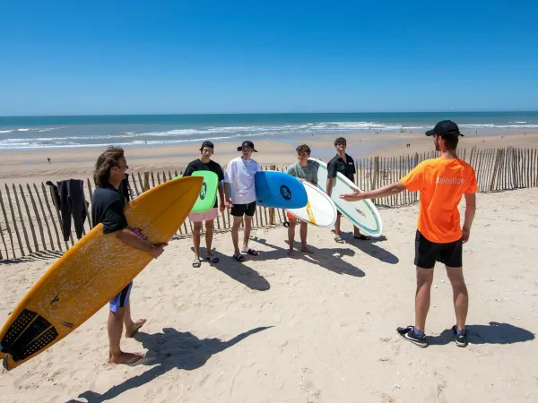 Surfing at the sandy beach of Roan camping Atlantic Montalivet.