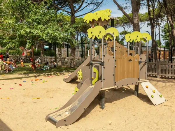 Small children's playground at Roan camping Le Castellas.