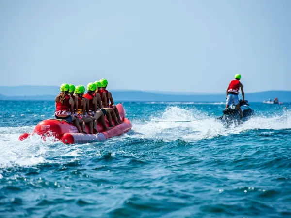 Banana boating on the sea at Roan camping Zaton Holiday resort.