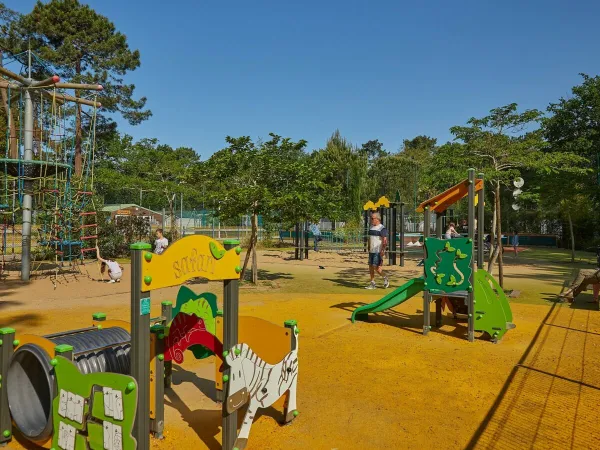Children's playground at Roan camping La Pinède.
