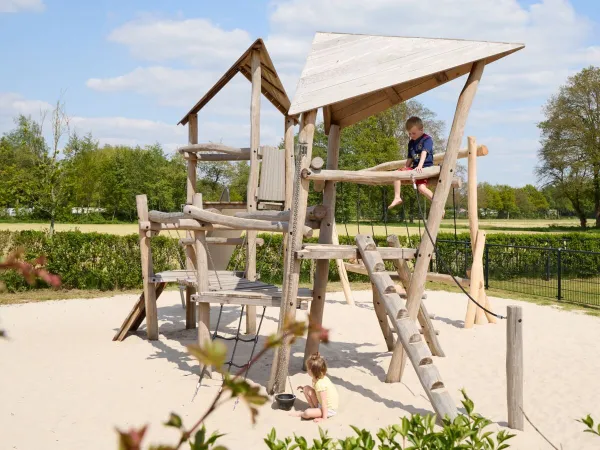 Little boy in the playground at Roan camping 't Veld.