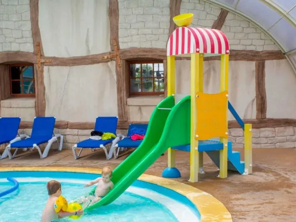 Children's pool with slide at Roan camping Le Domaine de Beaulieu