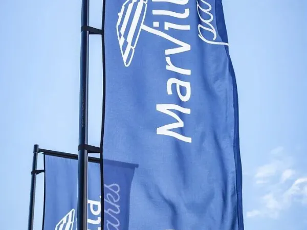 Flags with Marvilla Parks logo.