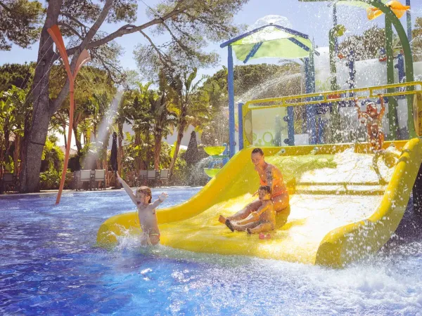 Slide fun in pool at Roan camping Playa Montroig.