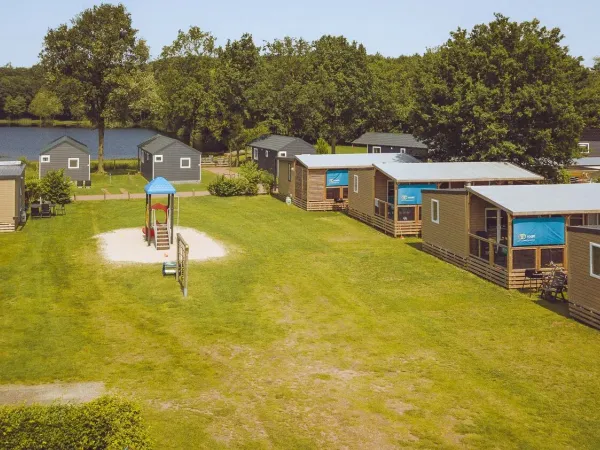 Luxury mobile homes on a field at Roan camping 't Veld.