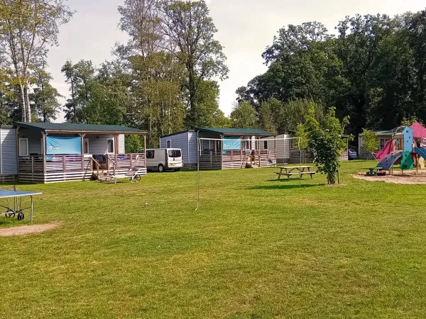 One of the cosy Premium Lounge pitches with playground at Roan campsite De Twee Bruggen.