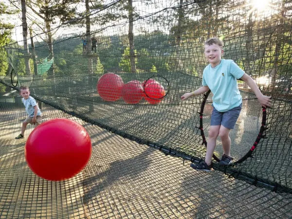 Playing in nets above ground at Roan camping hu Norcenni girasole village.