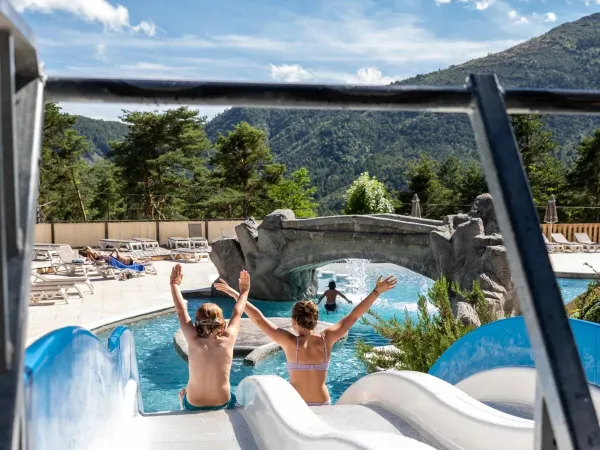 Two children on the slide at Roan campsite Les Collines de Castellane.